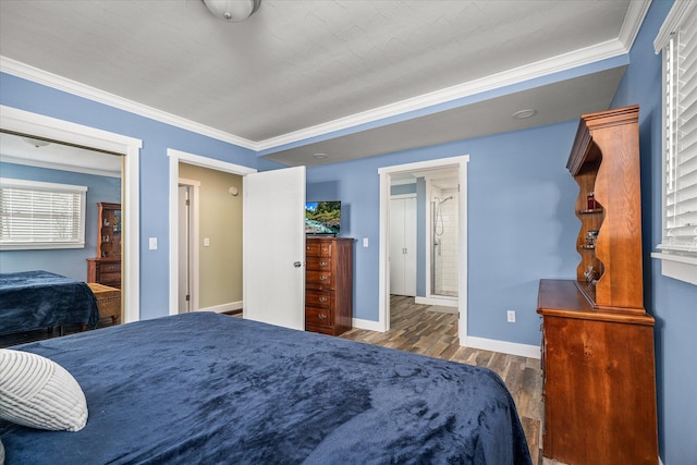 bedroom featuring crown molding and dark hardwood / wood-style floors