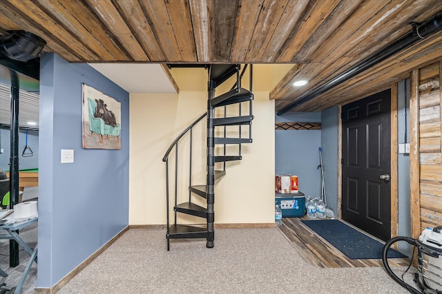 basement with carpet flooring and wood ceiling