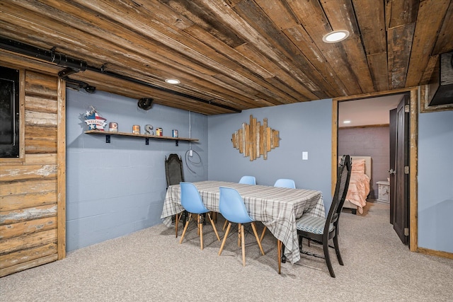 carpeted dining space featuring wood ceiling