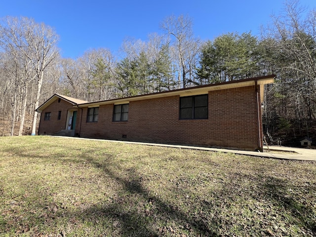 view of side of property with a yard