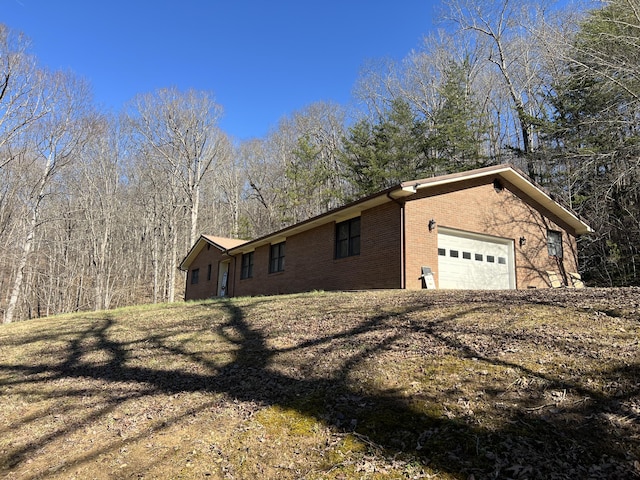 view of side of home with a garage