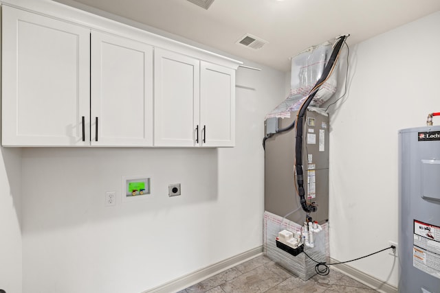 laundry area featuring electric dryer hookup, cabinets, washer hookup, and electric water heater