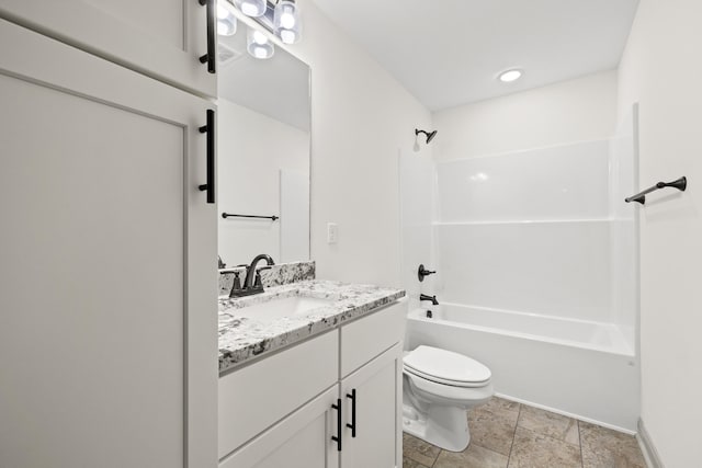 full bathroom featuring vanity, tub / shower combination, and toilet