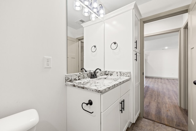 bathroom with vanity and toilet