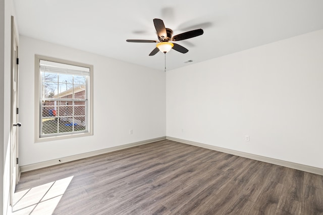 empty room featuring hardwood / wood-style floors and ceiling fan