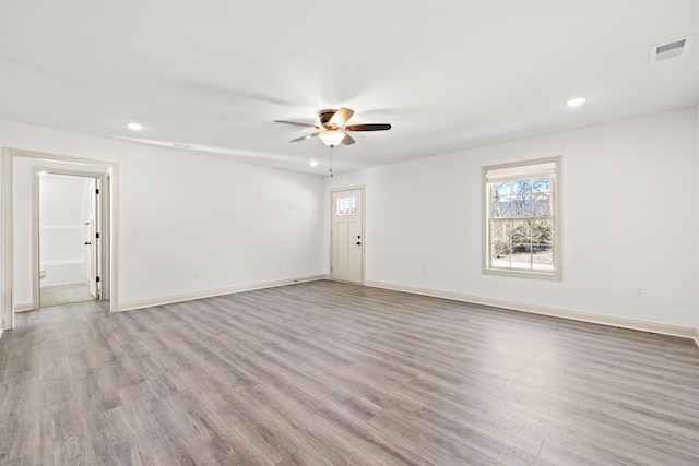 unfurnished room with ceiling fan and light hardwood / wood-style flooring