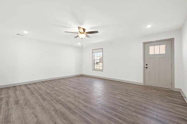 foyer entrance with dark wood-type flooring and ceiling fan