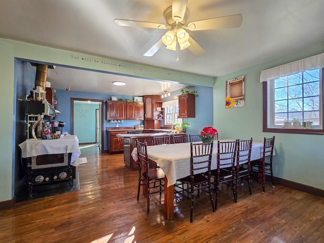 dining room featuring dark hardwood / wood-style floors and ceiling fan