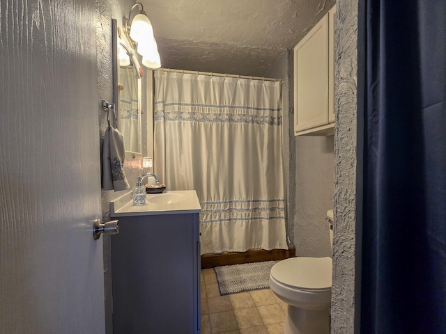 bathroom with toilet, a textured ceiling, vanity, a shower with shower curtain, and tile patterned flooring