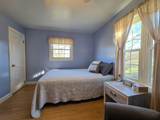 bedroom with wood-type flooring