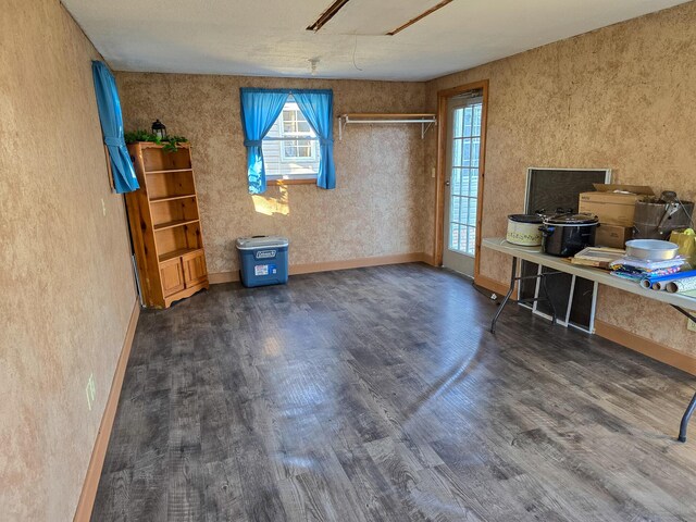 unfurnished office featuring dark hardwood / wood-style floors