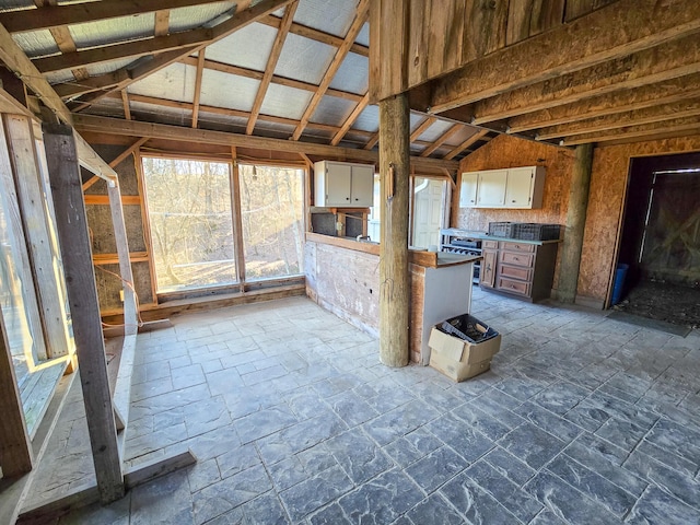 unfurnished sunroom with lofted ceiling