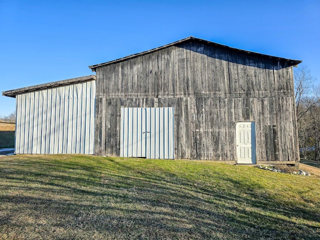 view of outdoor structure with a lawn