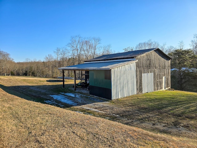 view of outbuilding with a yard