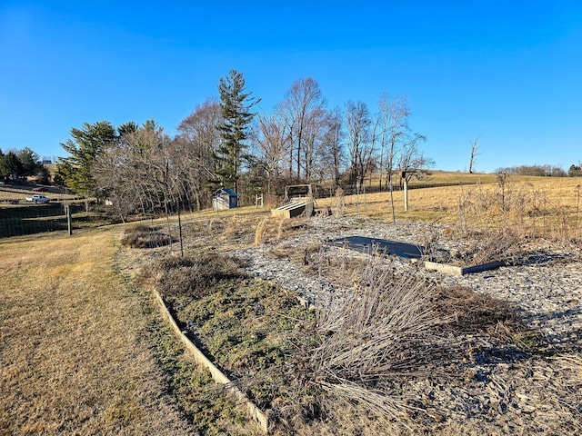 view of yard with a rural view