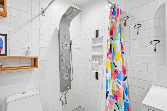 bathroom featuring toilet and a shower with shower curtain