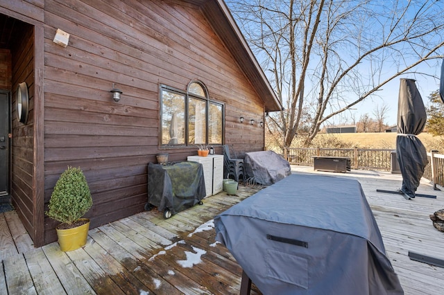 wooden terrace featuring grilling area