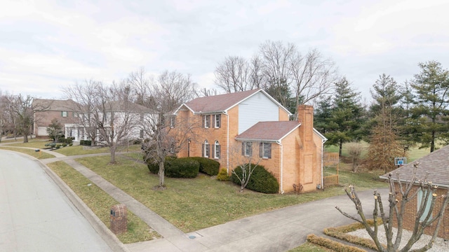 view of home's exterior featuring a lawn