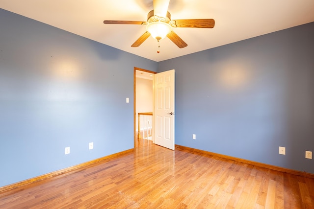 spare room featuring ceiling fan and light wood-type flooring