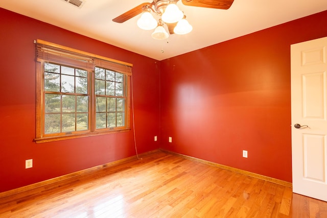 spare room featuring ceiling fan and light hardwood / wood-style flooring