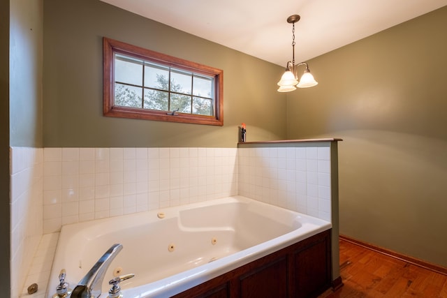 bathroom featuring wood-type flooring and a tub