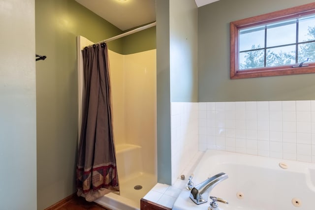 bathroom with separate shower and tub