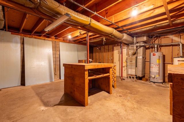 basement featuring water heater and heating unit