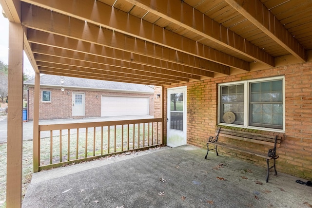 view of patio featuring a garage