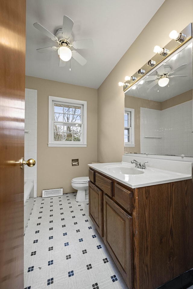 bathroom with vanity, ceiling fan, and toilet