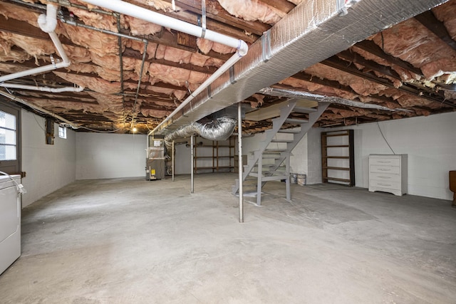 basement with washer / dryer and heating unit