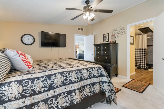 carpeted bedroom featuring lofted ceiling and ceiling fan