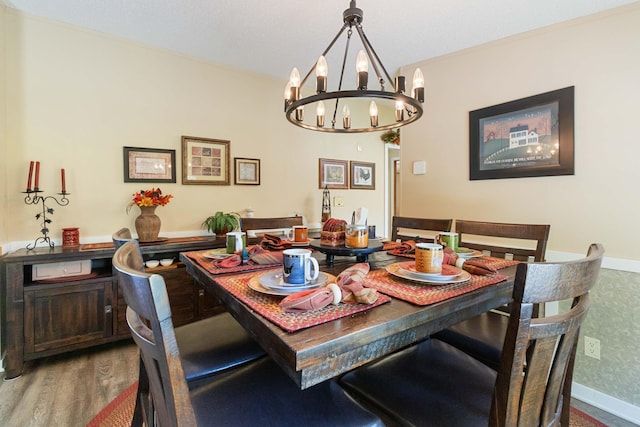 dining room featuring a notable chandelier and wood-type flooring