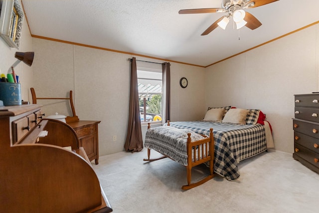 carpeted bedroom featuring crown molding, a textured ceiling, and ceiling fan