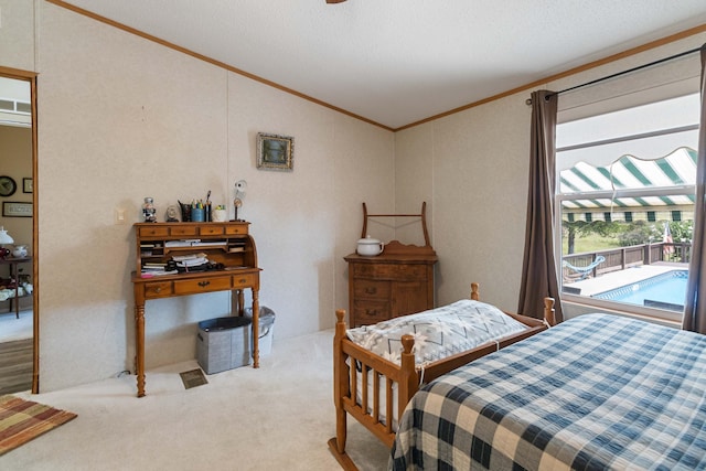 carpeted bedroom with crown molding and vaulted ceiling