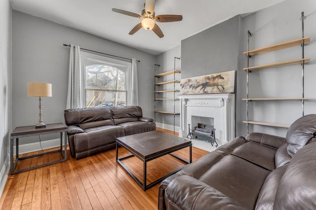 living room featuring ceiling fan and wood-type flooring