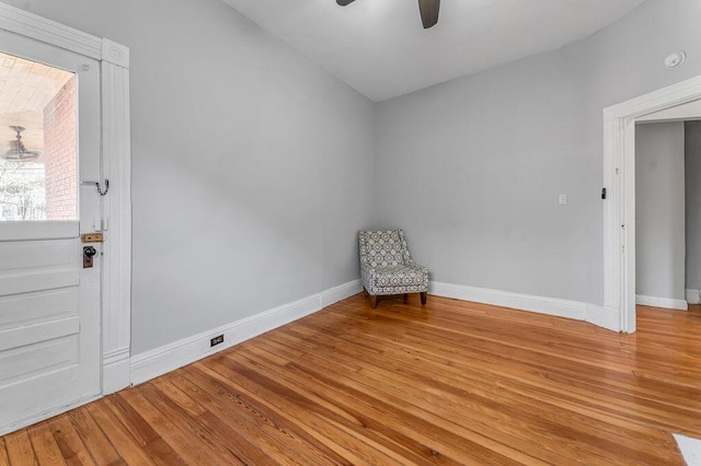 unfurnished room with hardwood / wood-style flooring and ceiling fan