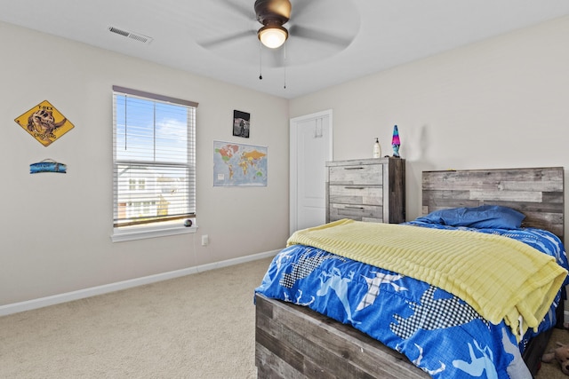 carpeted bedroom featuring ceiling fan