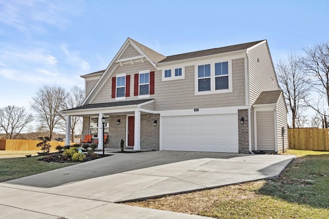 view of front of home featuring a porch and a garage