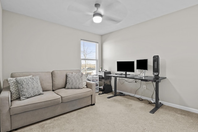 office space with ceiling fan and light colored carpet