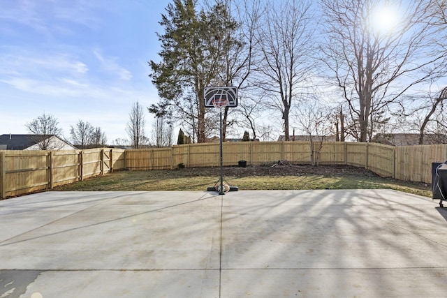 view of patio with basketball hoop