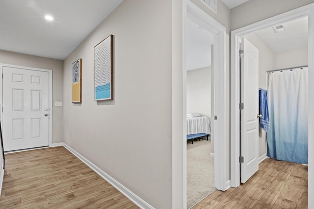 hallway featuring light hardwood / wood-style floors