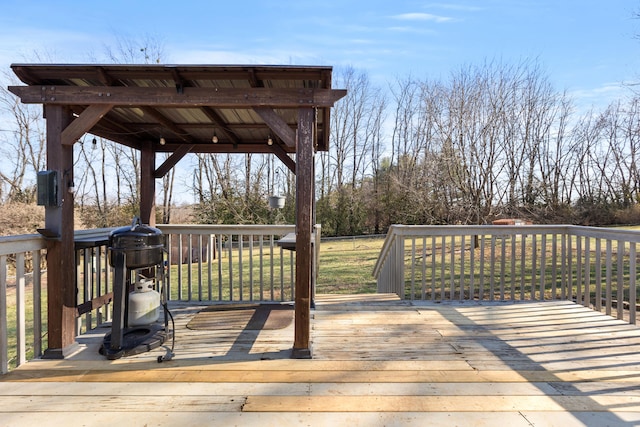 wooden deck with a lawn