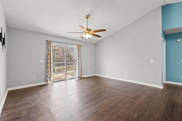 empty room featuring ceiling fan, lofted ceiling, a textured ceiling, and dark hardwood / wood-style flooring