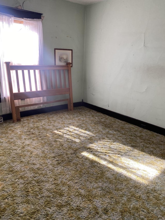 unfurnished room featuring carpet flooring