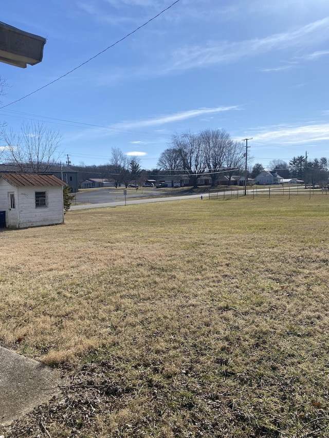 view of yard with a rural view