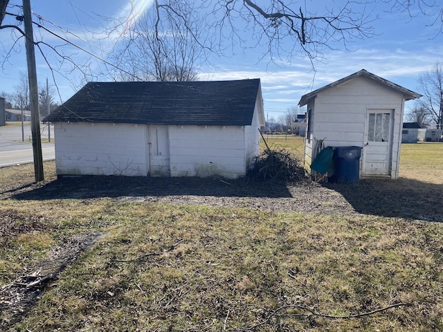 view of outbuilding with a yard