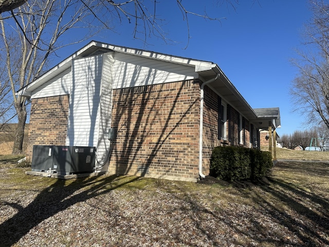 view of home's exterior with central AC