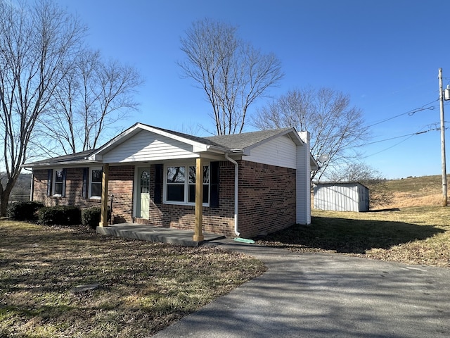 single story home with a storage unit