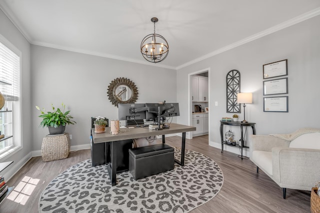 home office featuring an inviting chandelier, crown molding, and light hardwood / wood-style flooring