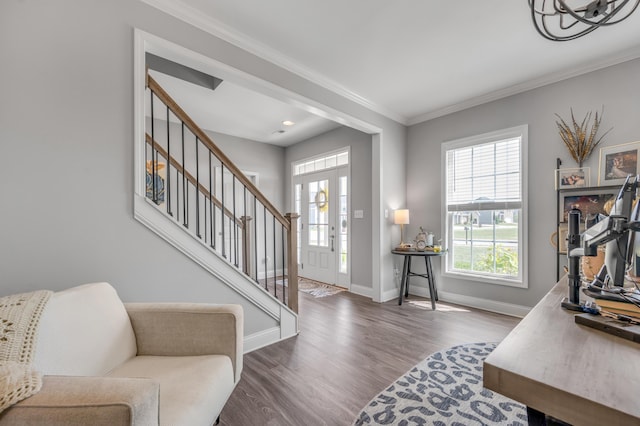 entrance foyer featuring ornamental molding and dark wood-type flooring